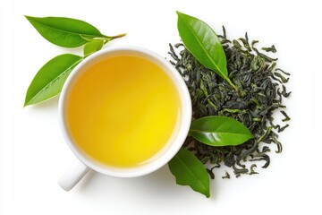 A cup of clear, light yellow-green tea, surrounded by fresh green tea leaves