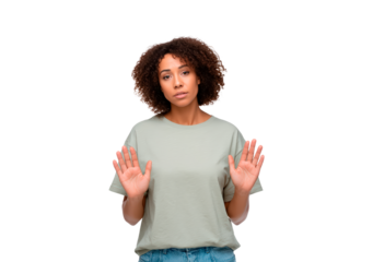 Young woman showing stop gesture with hands