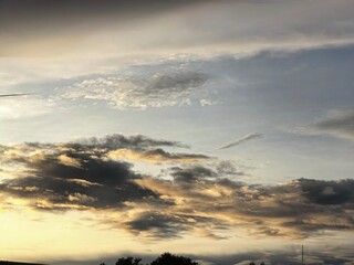 Dramatic Sunset Sky with Golden and Dark Clouds