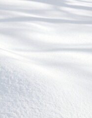 Fresh snow blanket with subtle shadows creating a serene winter landscape