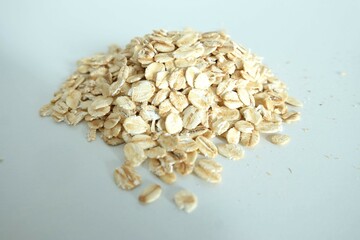 A pile of rolled oats with a white background, Ingredients for preparing a meal, Carbohydrate