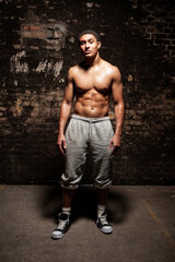 The Jock. An athletic young man showing off his physique and naked torso. Part of a series of...