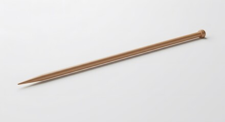 Wooden Knitting Needle Close-up Product Shot of a Single, Smooth, Light Brown Knitting Needle