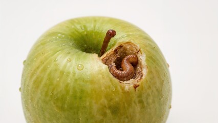 Green apple with a measuring tape, concept for diet and health.