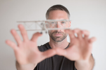 portrait of aeromodeller intensely focused on tuning their model