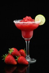 Strawberry Margarita: A refreshing strawberry margarita, elegantly presented in a classic glass, garnished with a lime and accompanied by fresh, ripe strawberries, perfect for summer.