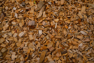 A pile of wood chips with a brownish color