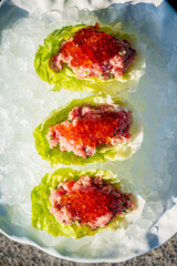 Enjoy a delightful Christmas appetizer featuring fresh seafood on a bed of ice for a festive touch