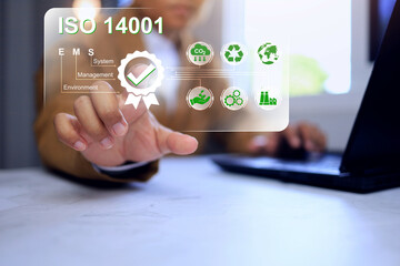 ISO 14001 with businessman pointing certificate environment management system to reducing...