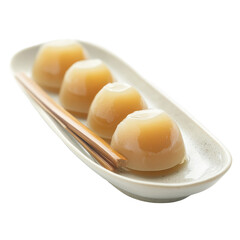 Delicate dessert served on a white plate with subtle elegance at a traditional dining setting