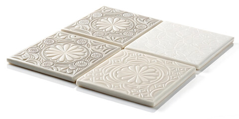 Fototapeta premium Elegant Embossed Ceramic Tiles Set of Four Square Tiles with Intricate Floral Designs