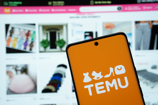 Dhaka, Bangladesh - 18 March 2025: The logo of the Temu is displayed on a smartphone screen, and the website temu is visible on a computer screen in the background.