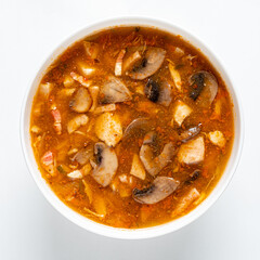 Tasty stew bursting with flavors features juicy chicken and mushrooms in a rich, spicy broth