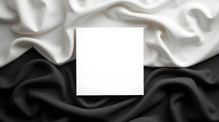 Naklejka premium White square on black and white silk fabric