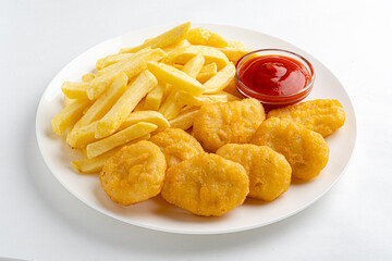 An appetizing plate features golden nuggets, crispy fries, and a small bowl of ketchup for dipping