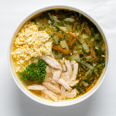 Hearty chicken soup with tender meat, vibrant veggies, and herbs for a warm delight