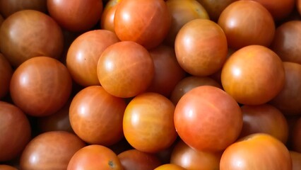 Close-up of organic cherry tomatoes with a matte shine, ideal for promoting farm-to-table produce and clean eating.
