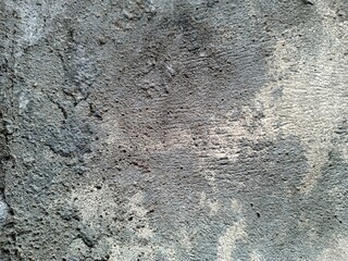 Grunge Scratched Gray Concrete Wall Texture Background.Grunge Gray Concrete Wall Texture Background.Rough gray grunge texture of a scratched and weathered concrete wall surface. Ideal for use in backg