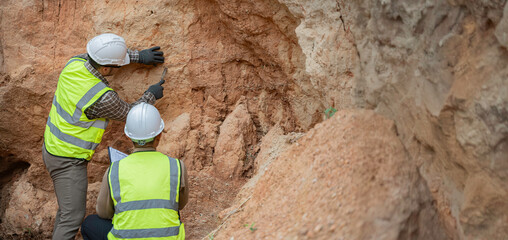 Geologist surveying mine,Explorers collect soil samples to look for minerals, A geologist is a...
