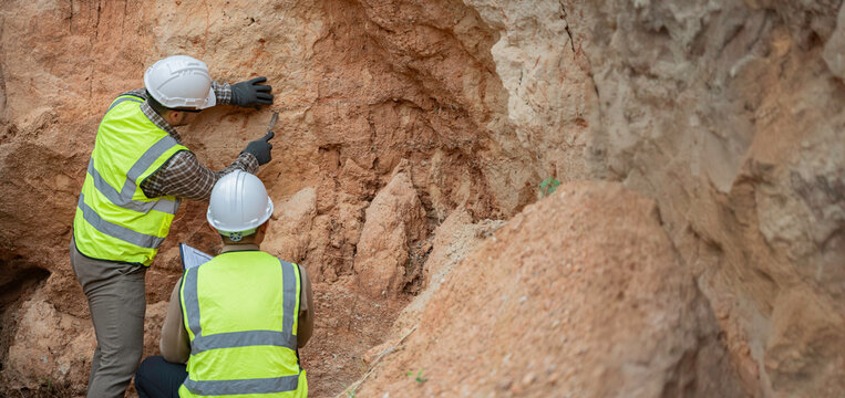 Geologist surveying mine,Explorers collect soil samples to look for minerals, A geologist is a scientist who studies the Earth's physical structure and substances