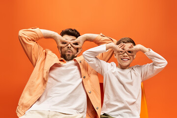 Joyful father and son share playful moment on Father Day celebration in 2025