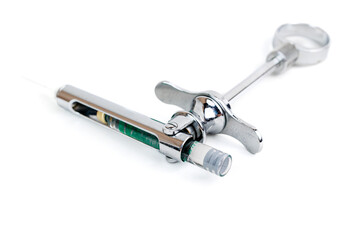 Close-Up of Dental Anesthesia Syringe with Cartridge on White Background, Detailed image of a metal dental syringe containing an anesthesia cartridge.