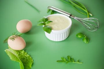Green background and products for making fresh mayonnaise