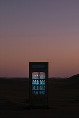 Desert Oasis: A vending machine stands alone against the dusky sky.