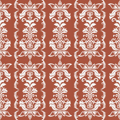 A seamless vintage floral damask pattern in white on a warm terracotta background, creating an elegant and classic decorative design.