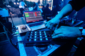 DJ or Sound Engineer Working on a Console