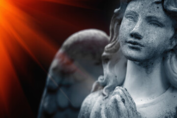 Portrait of beautiful sad angel in the rays of light. Fragment. Horizontal image.