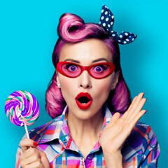 Excited expressive surprised woman with lollipop. Pin up girl model in red eye glasses eyeglasses. Black Friday discounts sale concept. Isolate blue green background. Retro vintage image