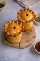 English pie with three types of meat, nuts, spices.