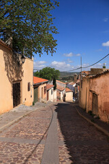 Narrow street with beautiful houses in Alcaraz town