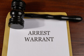 Arrest Warrant Legal Document on Desk with Gavel – Law Enforcement Concept