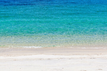 Turquoise Andaman Sea meets a sandy beach under a blue sky. Awesome tropical sea landscape. Koh Adang, Thailand.