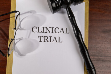 Clinical Trial Legal Document with Gavel – Medical Research and Regulatory Oversight Concept