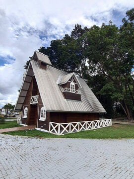 European style wooden and brick house used as a store in a square in Sinop, Mato Grosso, Brazil.