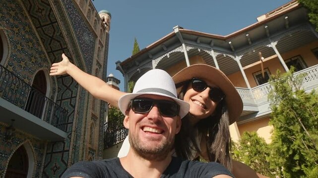 Joyful heterosexual couple looking at camera taking selfie photo laughing and enjoying bright summer vacation moments. Concept connection, happiness, freedom. Romantic couple have fun central asia
