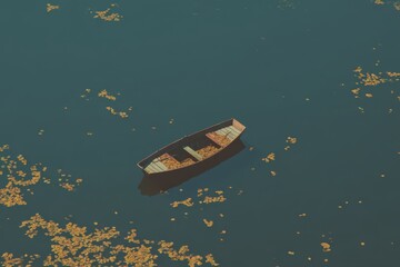 Boat resting in tranquil waters surrounded by scattered autumn leaves beneath a clear blue sky at midday