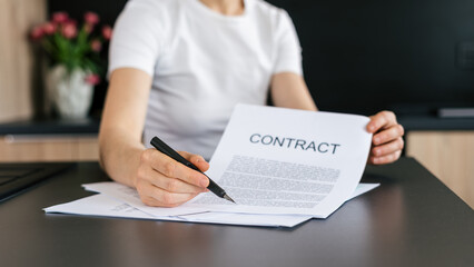 Signing an important contract at a modern home office workspace