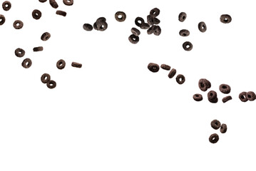 Chocolate rings cereal spill out into a bowl. Breakfast.