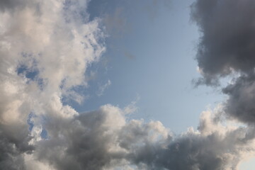 white and black clouds in the blue sky