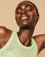 Young black woman smiling with eyes closed, feeling relaxed and expressing happiness