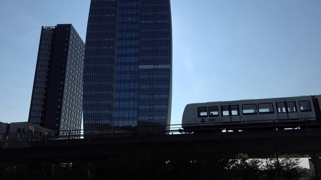 Copenhagen, Denmark An elevated Metro train on the M1 line passes the modern buildings in the Orestad district.  