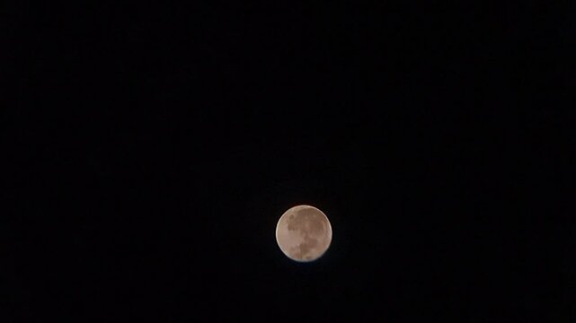 Strawberry moon June 12, 2025 in the night sky in Bogor, Indonesia, taken with a realme c25 camera and DIY binoculars