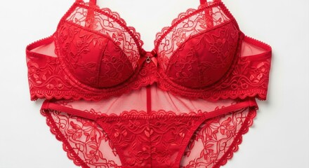 Elegant red lace lingerie set featuring intricate floral design on bra and panties on white background