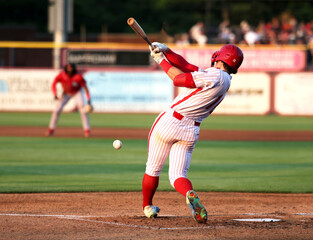 baseball hitting a ball off the bat - obrazy, fototapety, plakaty