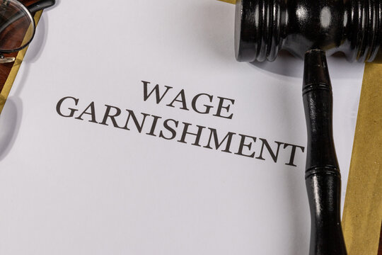 Wage Garnishment Title on Legal Documents Set on Desk – Legal Concept