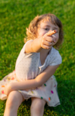 Fototapeta premium Child playing with ladybug. Selective focus.